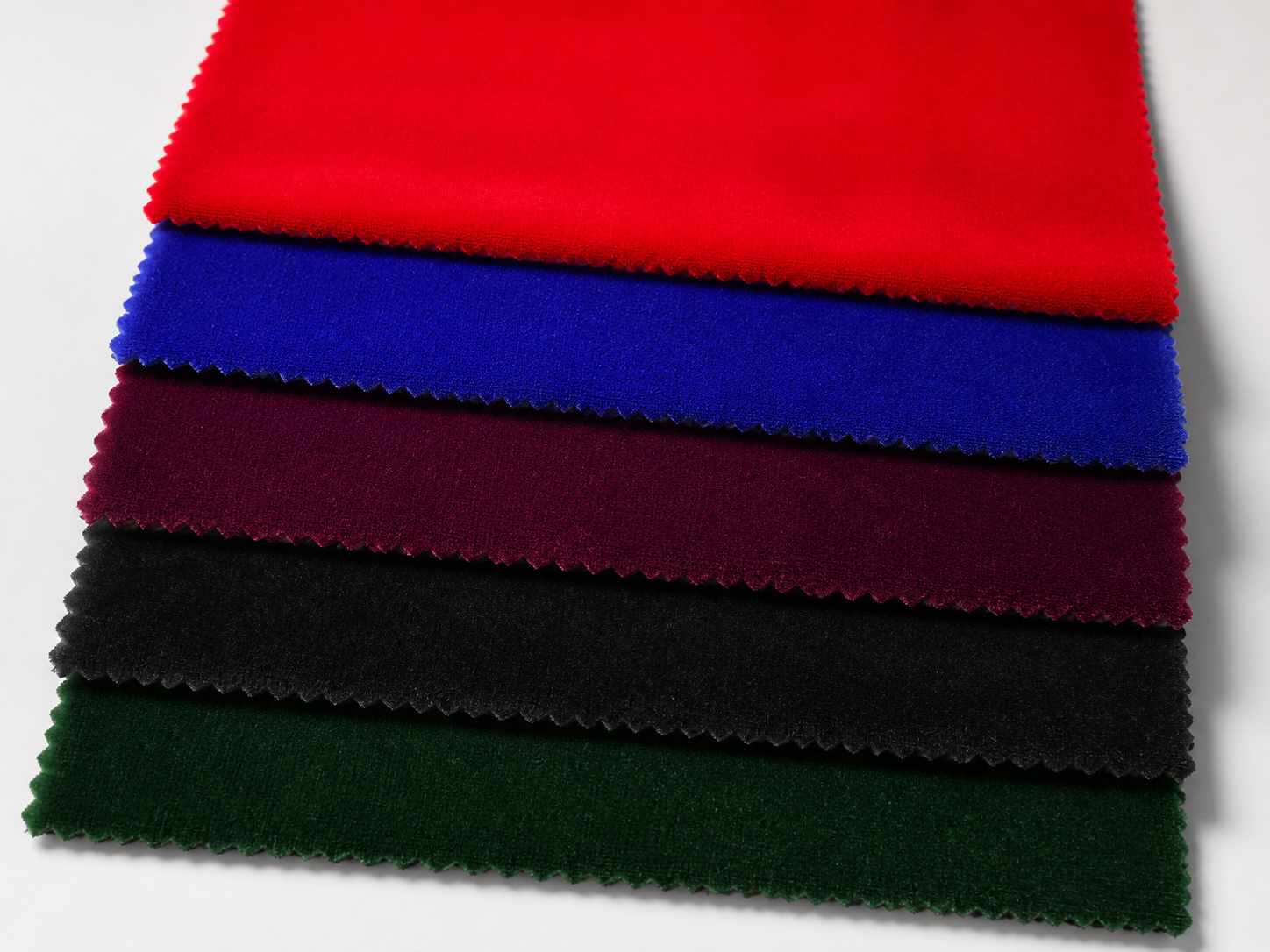 Neatly layered Korean velvet color swatches showing a soft pile and rich luster
